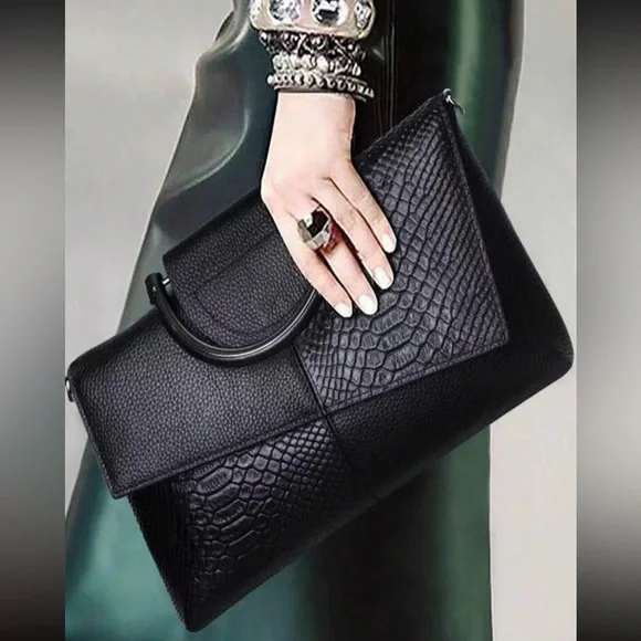 Black snakeskin print vegan leather clutchcrossbody bag